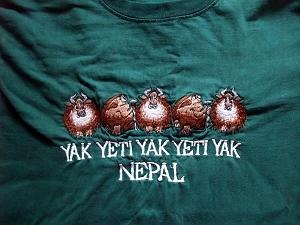 A Kathmandu tourist T-shirt reading "yak yeti yak". Not imagery of the 1986 event.